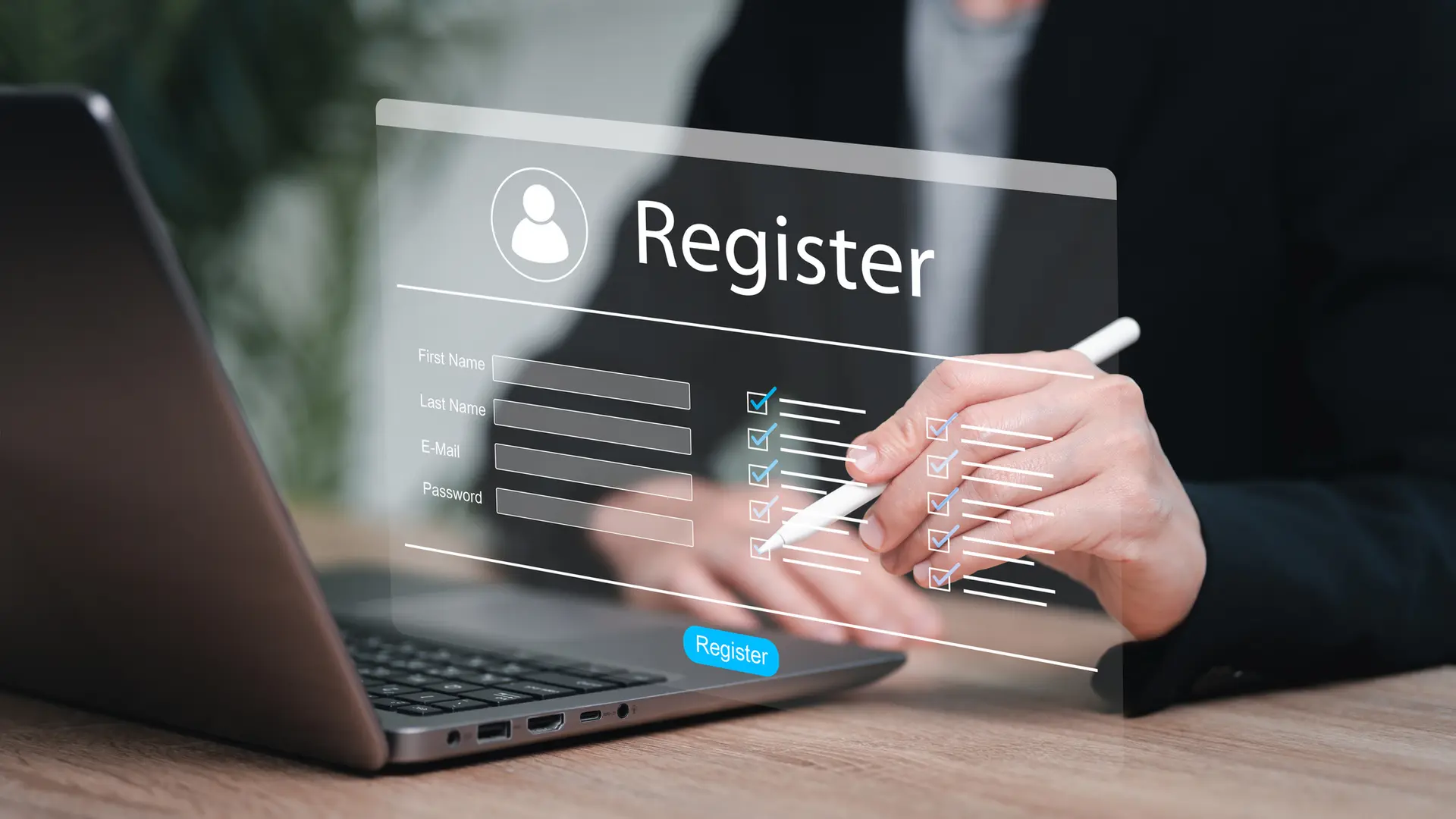Laptop with hands and a screen showing register
