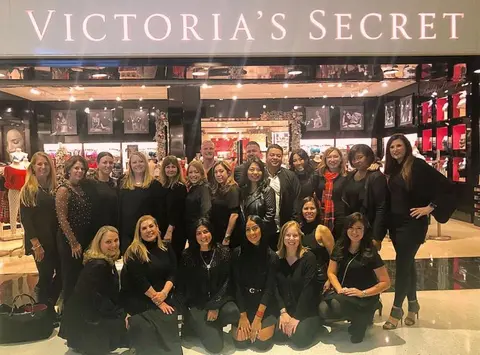 Staff in front of store