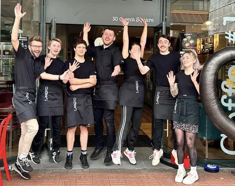 Staff outside a Coffee #1